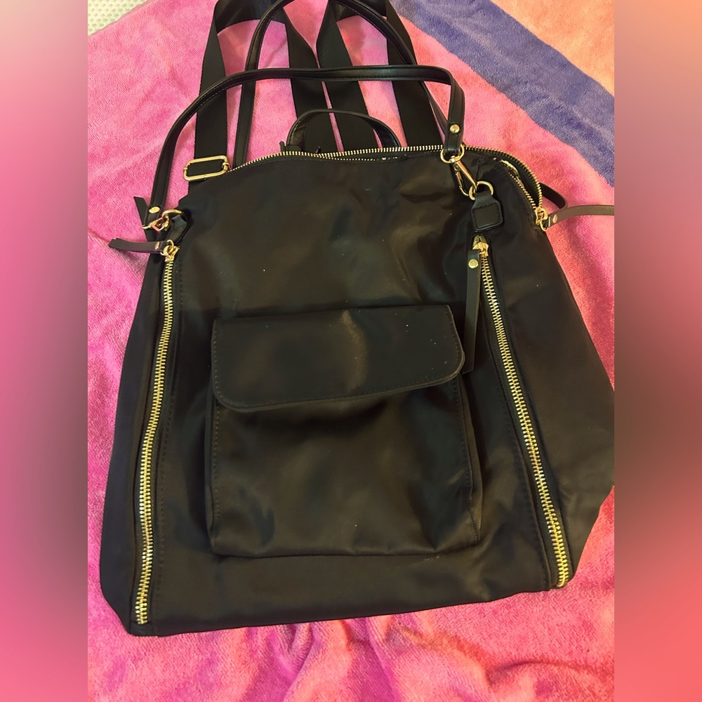 Black Backpack with Gold Accents; lots of zippers and pockets